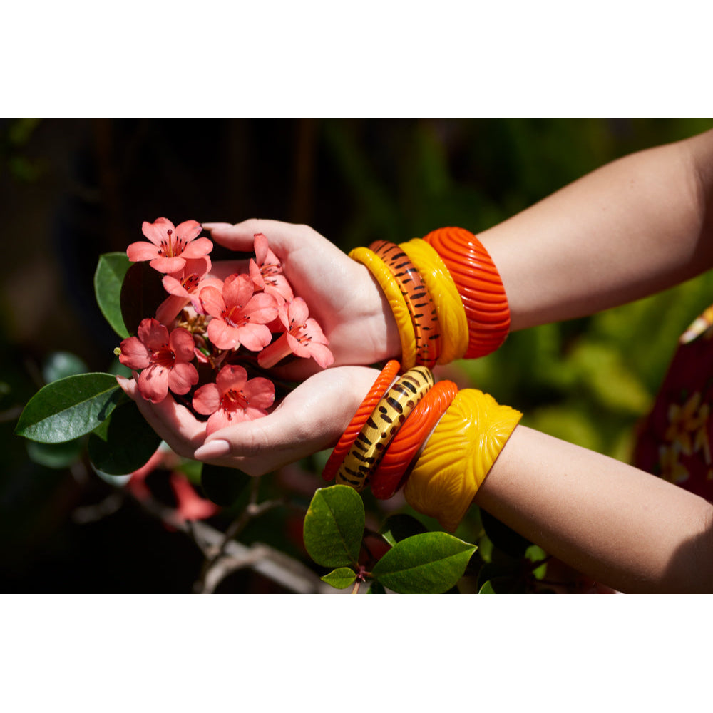 Wide Papaya Heavy Carve Fakelite Bangle by Splendette - MEDIUM